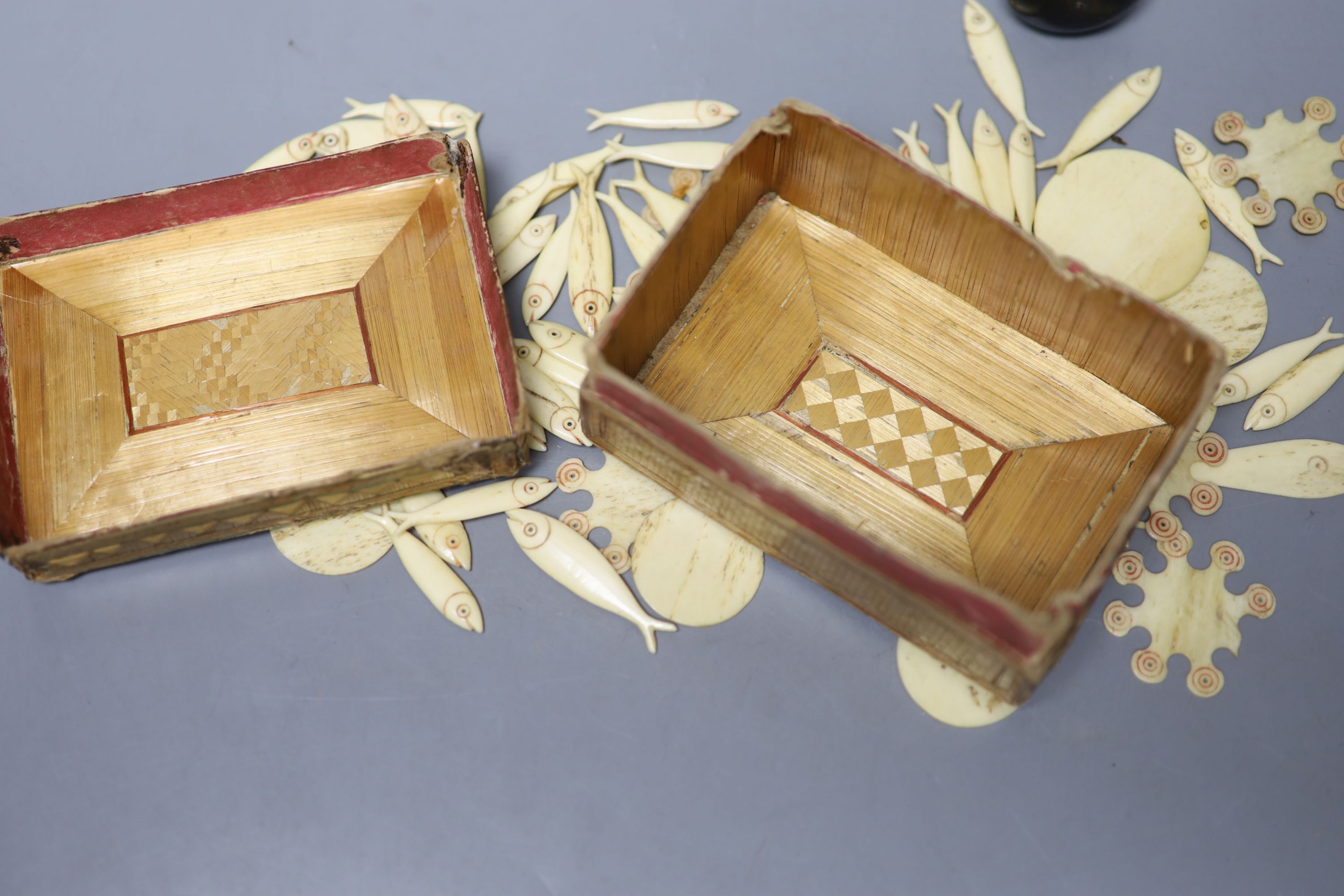 A small quantity of Victorian bone gaming counters, contained within straw work box and a dice shaker containing five dice